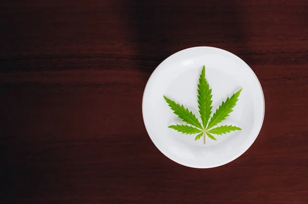 Detail of cannabis hemp cream with marijuana leaf - cannabis top