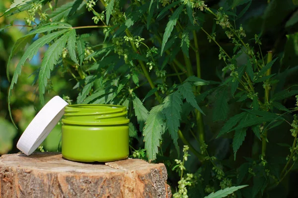 Side view of a jar of CBD or hemp salve. Macro close up of jar w — Stock Photo, Image