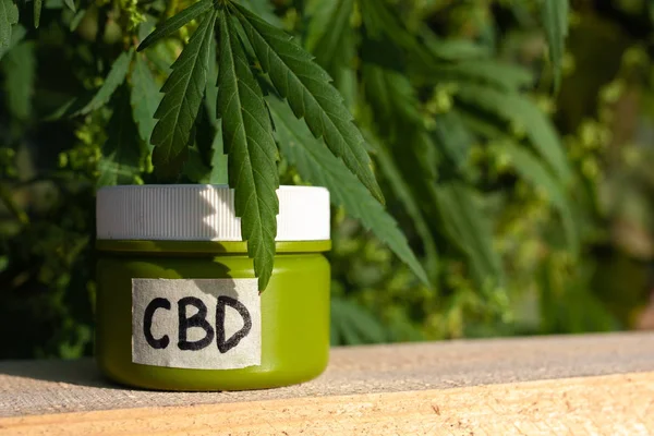 Cannabis medical products in jar with the inscription CBD with g