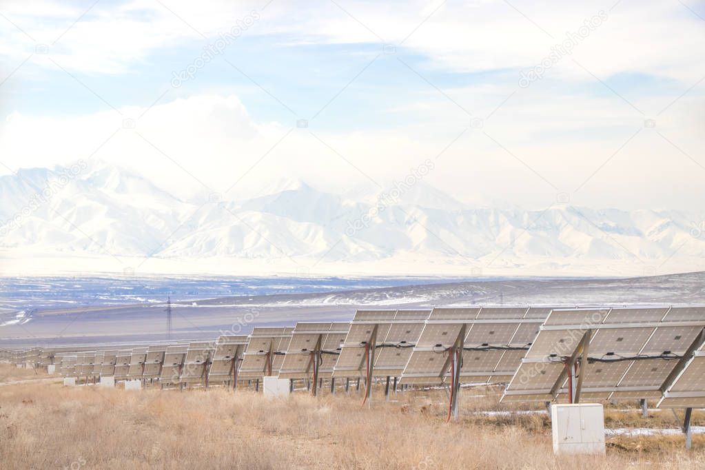 Solar Power Station with mountains. Solar Energy in Kazakhstan
