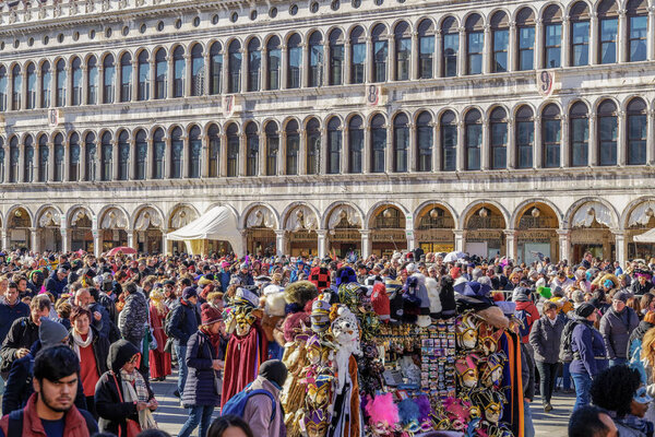 Venice, Italy - February 23 2019: Crowd gathered for the Venice Carnival at Saint Mark square.