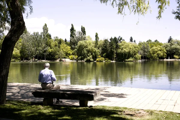 MAN ON THE LAKE RESTING