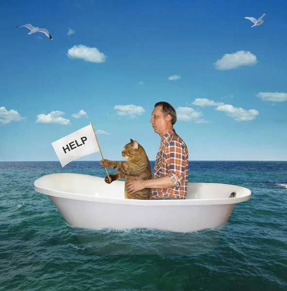 El hombre con su gato deriva en el mar 2 — Foto de Stock