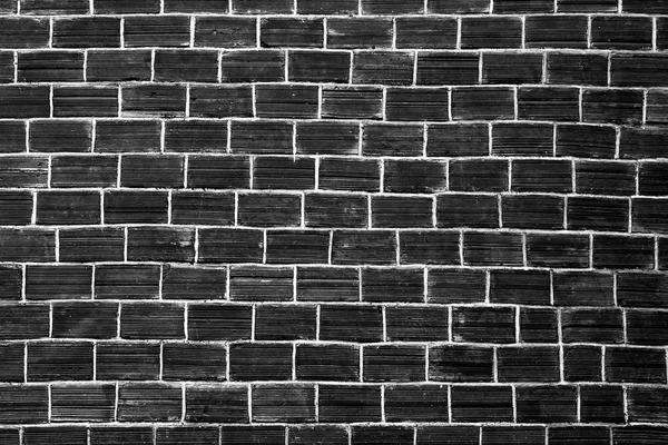 Black brick wall texture . Background.