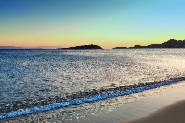 Sea at sunset. Summer evening on an island in Greece. Selective focus.