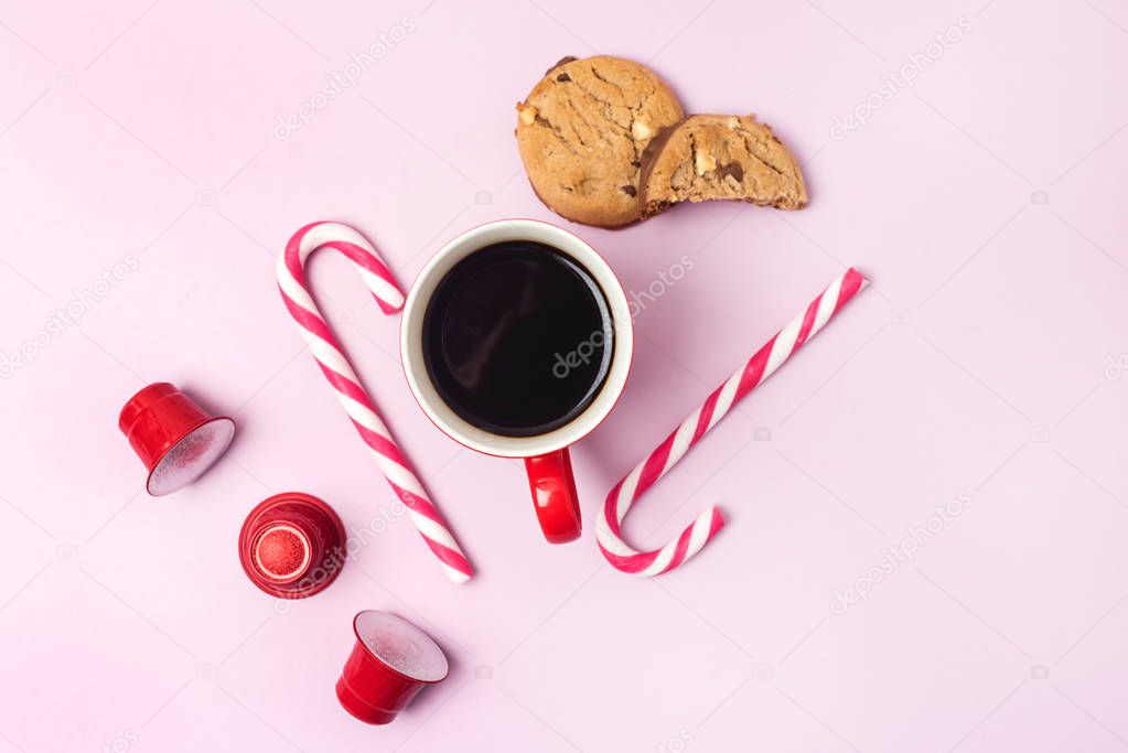 Coffee Cup Red Cofffee Capsules Candy Canes Pink Background Cookies Christmas background Top view Flat Lay