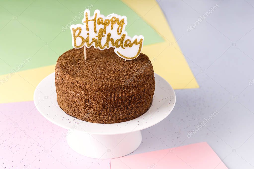 Happy Birthday Candles on Chocolate Cake Tasty Chocolate Homemade Cake for Holiday Muiticolored Background Copy Space