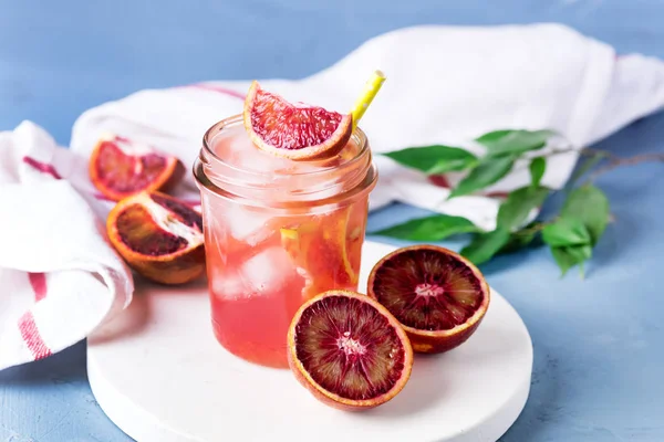Glass Jar of Summer Juice Non-alcoholic Refreshing hHealthy Cocktail or Drink from Freshly Squeezed Red Sicilian Orange Healthy Infused Detox Drink Horizontal