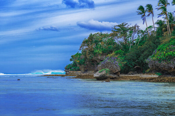 Tropical landscape hill, clouds and mountains rocks with rainforest. Tropical island, sea bay and lagoon, Siargao. Azure water of lagoon. Shore Landscape Bay. Travel concept