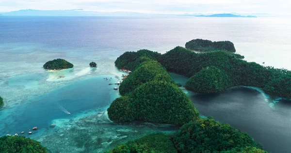 Aerial view of Sugba lagoon. Beautiful landscape with blue sea lagoon, National Park, Siargao Island, Philippines.