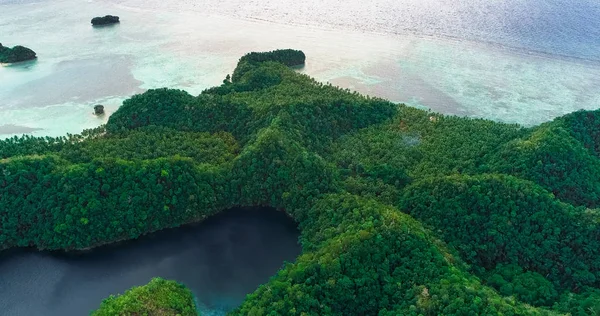 Aerial view of Sugba lagoon. Beautiful landscape with blue sea lagoon, National Park, Siargao Island, Philippines.