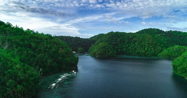 Aerial view of Sugba lagoon. Beautiful landscape with blue sea lagoon, National Park, Siargao Island, Philippines.