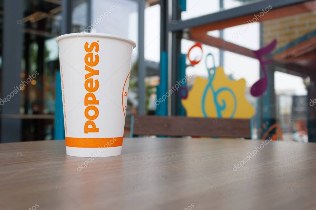 A paper cup from the fast-food chain Popeyes in Alfaz del Pi on September 8, 2025, Spain.