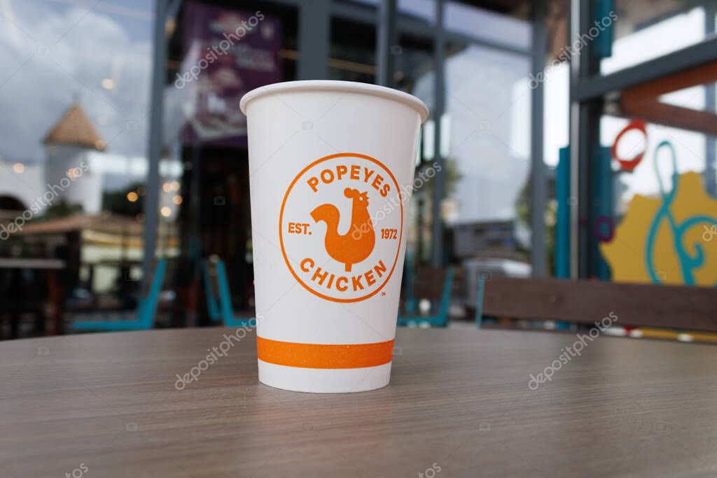 A paper cup from the fast-food chain Popeyes in Alfaz del Pi on September 8, 2025, Spain.