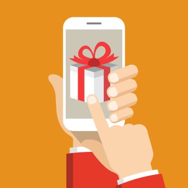 Ekranda hediye kutusu ile akıllı telefon tutarak el. Turuncu arka plan üzerinde vektör düz illüstrasyon