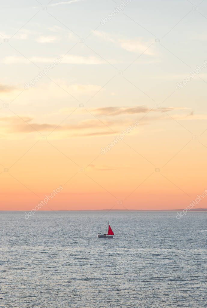 evening seascape. Red sail at sunset