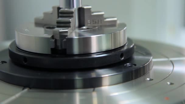 Metal parts produced in heavy industry. Cutter rotating on stand — Stock Video