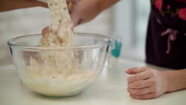 Child hands cooking dough. Girl hand preparing dough. Daughter preparing cake — Αρχείο Βίντεο