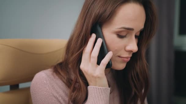 Beautiful woman face talking phone. Portrait of speaking woman with mobile — Stock Video