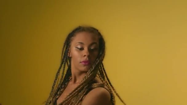 Expressive woman with afro dreadlocks dancing in studio front camera — Stock Video © stockbusters #272073652 Expressive woman with afro dreadlocks dancing in studio front camera — Stock Video © stockbusters #272073652