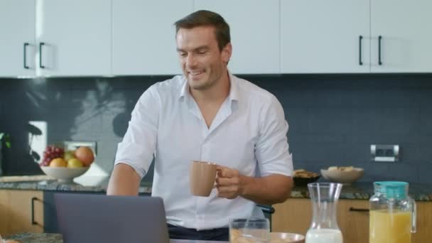 Smiling man drinking coffee during skype call. Closeup man having online chat. — Stock Video