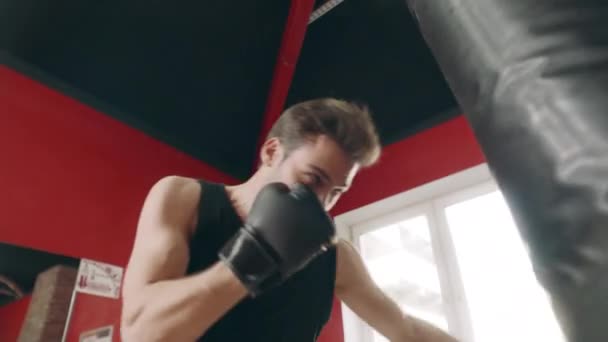 Kickboxer man making strikes at fight training. Sportsman having cardio training — Stock Video
