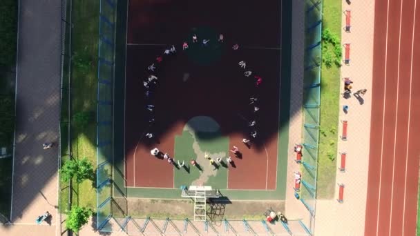 School children training gym class outdoor. Aerial view Physical education class — Stock Video