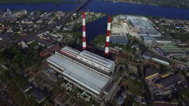 Industrial chimneys on hydro power station. Aerial view pipe water power plan