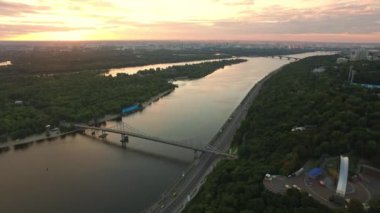 Colorful sky over evening city. Aerial view evening sunset in city landscape