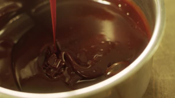 Mixing chocolate with spatula in slow motion. Closeup chocolate stream. — Stock Video