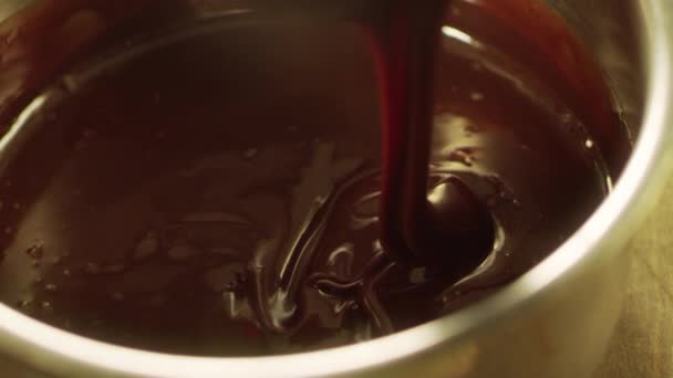 Mixing chocolate with whisk in slow motion. Closeup liquid hot chocolate. — Stock Video