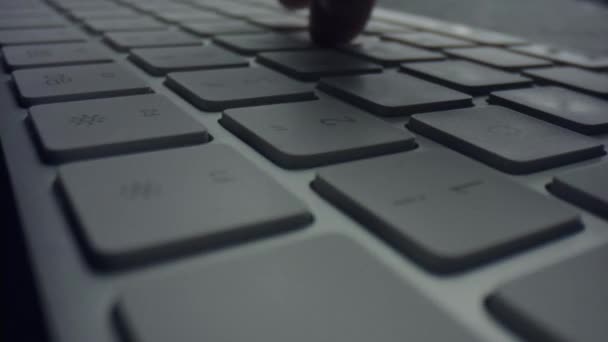 Macro of male fingers pressing white keys on computer keyboard — Stock Video