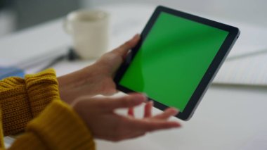 Closeup business woman making video call on green screen tablet.
