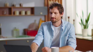 Businessman using laptop computer at home office. Business man working on laptop