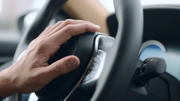 Nervous unrecognized driver beeping in car. Closeup male hand pushing horn — Stock Photo, Image