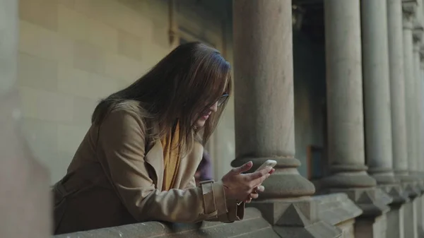 Student reading good news on smartphone. Businesswoman working on cellphone