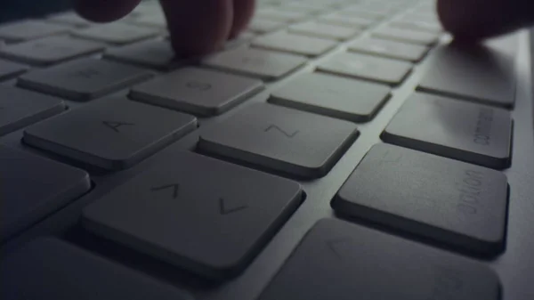 Unrecognizable person pressing buttons on keyboard. Man hand using computer — Stock Photo, Image