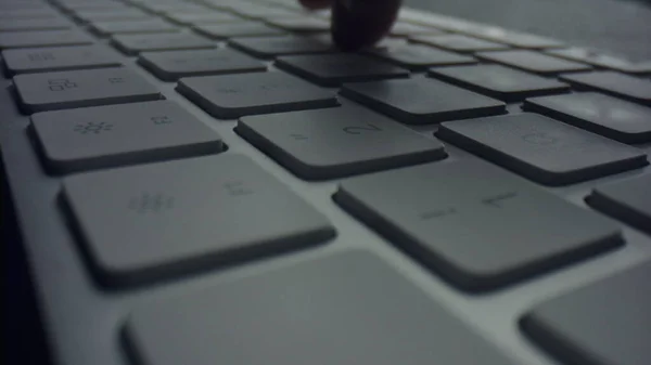 Macro of male fingers pressing white keys on computer keyboard — Stock Photo, Image