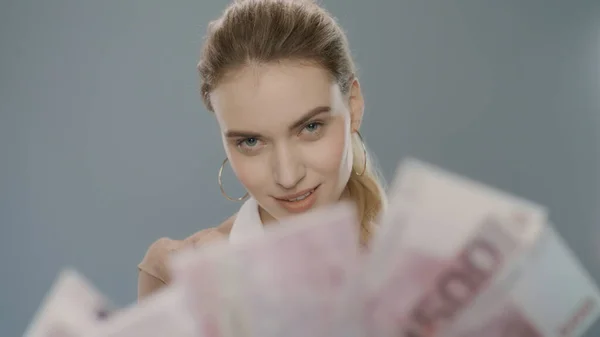 Rich business woman counting money cash in slow motion. Woman counting euro