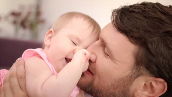 Father kissing daughter at home. Happy father day. Dad kiss baby — Stock Photo, Image