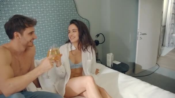 Couple clinking glasses luxury apartment. Couple enjoying romantic weekend. — Stock Video