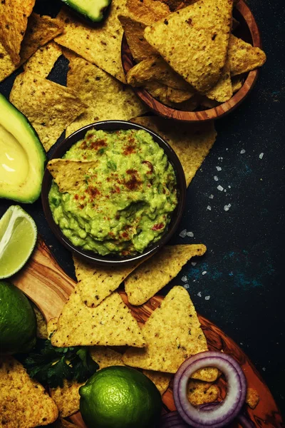 Spicy Mexican Food, Corn Nachos and Guacamole Sauce, Food Background, Top View
