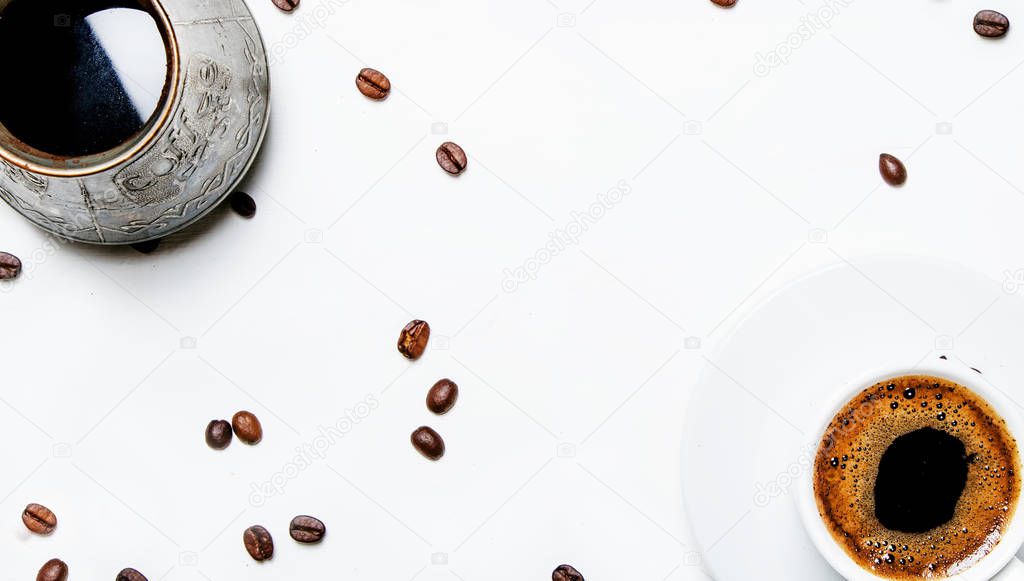 Turkish coffee maker, cup with hot espresso coffee, white background, top view