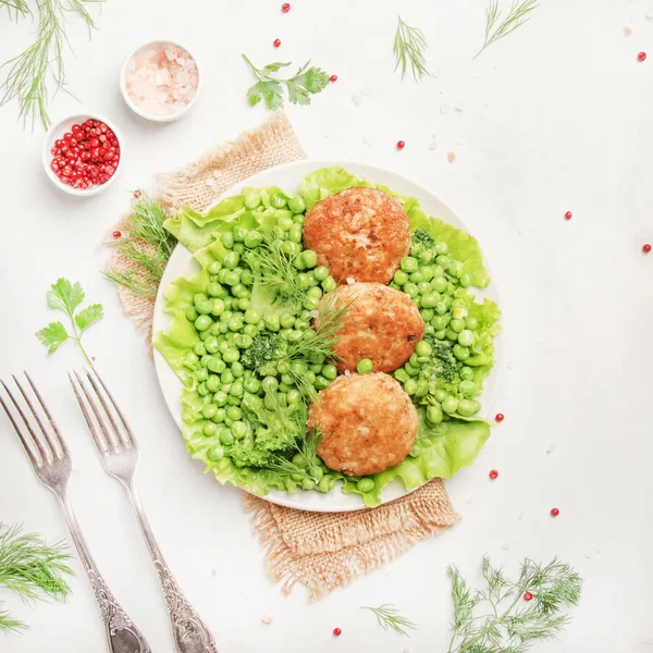 Fish meatballs or cutlets from sea cod with green vegetables, top view — Stock Image Fish Meatballs Cutlets Sea Cod Green Vegetables Top View Royalty Free Stock Images
