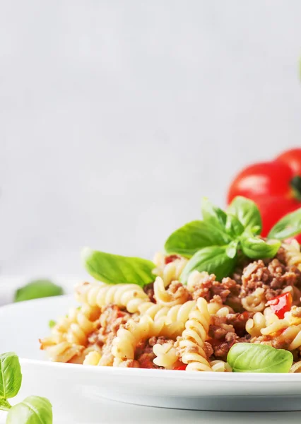 Prepared Pasta Meat Sauce Tomatoes Basil White Plate Selective Focus — Stock Photo, Image