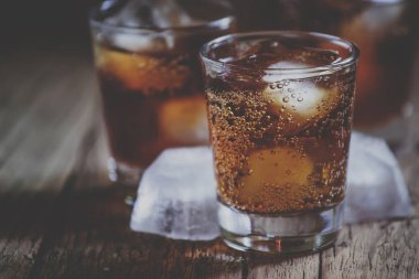 Alcoholic cocktail bourbon cola with whiskey and ice cubes clipart