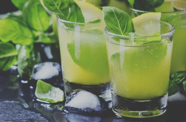 Lemonade with kiwi, green basil, grapefruit syrup and ice