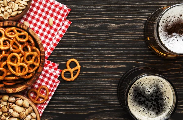 Light Dark Beer Mugs Salty Snacks Nuts Dark Wooden Table — Stock Photo, Image