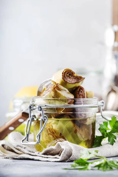 Artichokes Olive Oil Jar Lemon Herbs Gray Kitchen Table Background — Stock Photo, Image