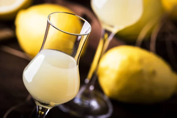 Limoncello, sour sweet Italian lemon liqueur, traditional strong alcoholic drink. Copy space, selective focus